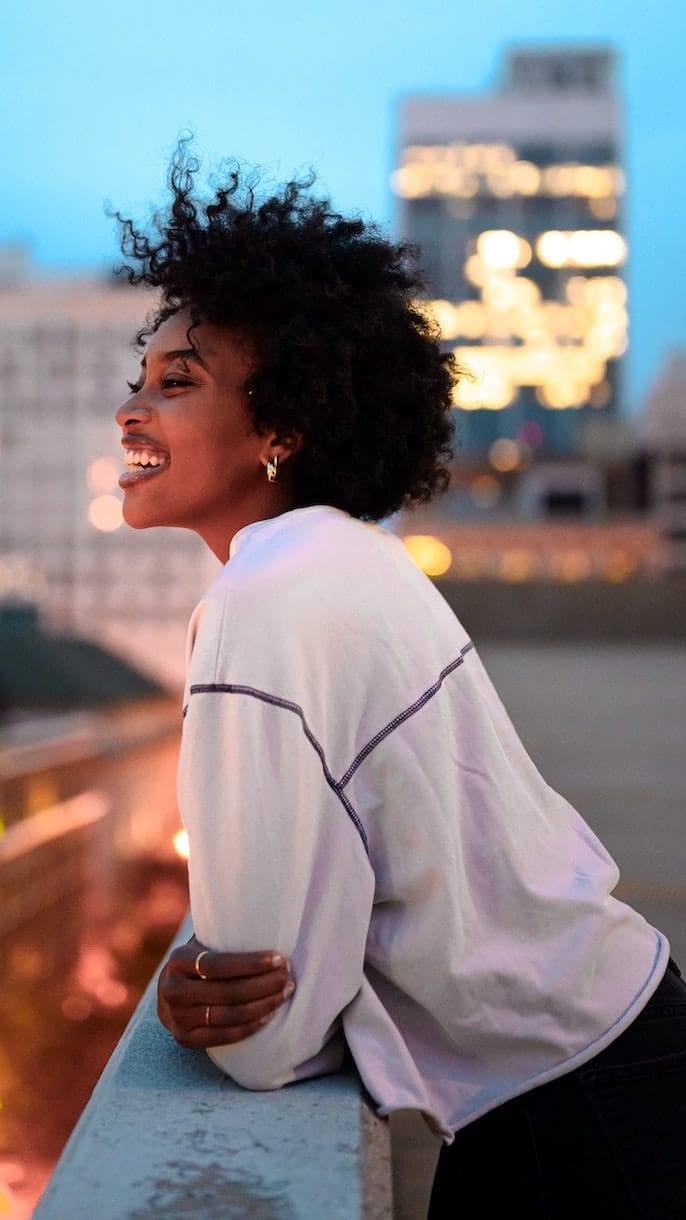 women smiling on rooftop